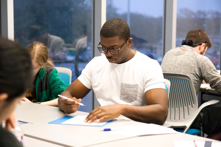 young student writing